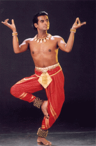 A man dancing traditional dances of India.